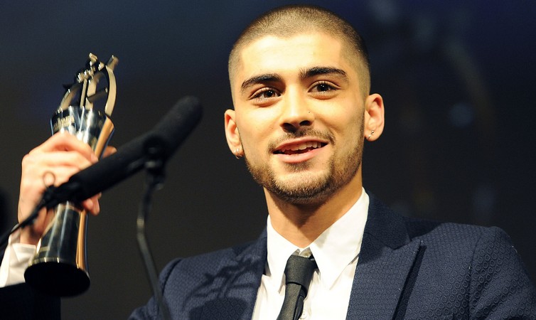 LONDON, ENGLAND - APRIL 17:  SUN NEWSPAPER OUT. MANDATORY CREDIT PHOTO BY DAVE J. HOGAN GETTY IMAGES REQUIRED  Zayn Malik accepts his award for Outstanding Achievement in Music during The Asian Awards 2015 at The Grosvenor House Hotel on April 17, 2015 in London, England.  (Photo by Dave J Hogan/Getty Images)