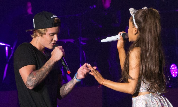 Justin Bieber and Ariana Grande show off their moves as they perform together during Ariana Grande's The Honeymoon Tour at the Forum in Inglewood, CA