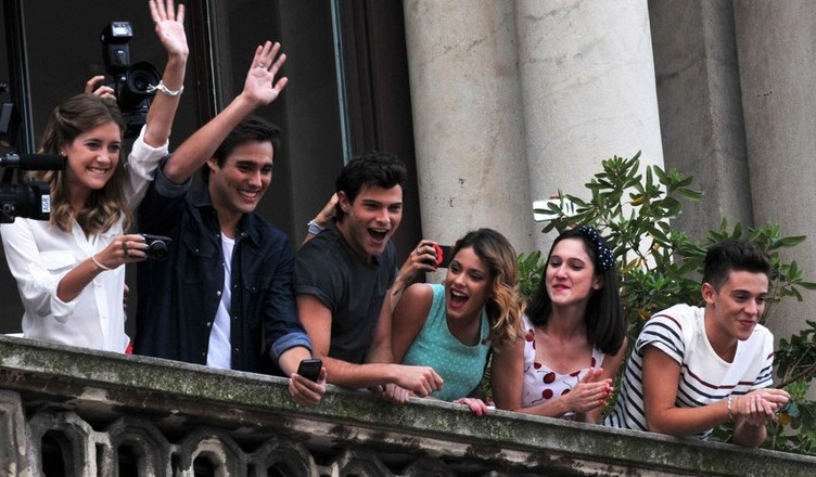 The cast of famous television series, Violetta and E' Grave, seen interacting and greeting their fans from the terrace of Mondadori at Piazza Duomo in Milan