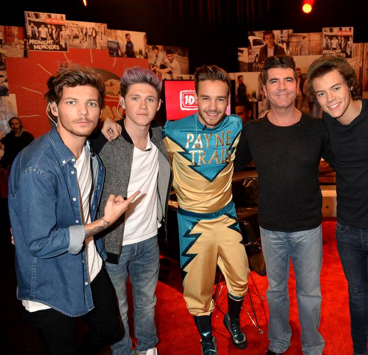 PLAYA VISTA, CA - NOVEMBER 23: (L-R) Louis Tomlinson, Niall Horan, Liam Payne, Simon Cowell, Harry Styles, and Zayn Malik on set during One Direction celebrates 1D Day at YouTube Space LA, a 7-hour livestream event broadcast exclusively on YouTube and Google+. Featuring behind the scenes footage, Guinness world record attempts, and amazing special guests, the global event also marked the premiere of tracks from their new album 'Midnight Memories', set for release November 25th, in Playa Vista, California on November 23, 2013 (Photo by Jeff Kravitz/FilmMagic)
